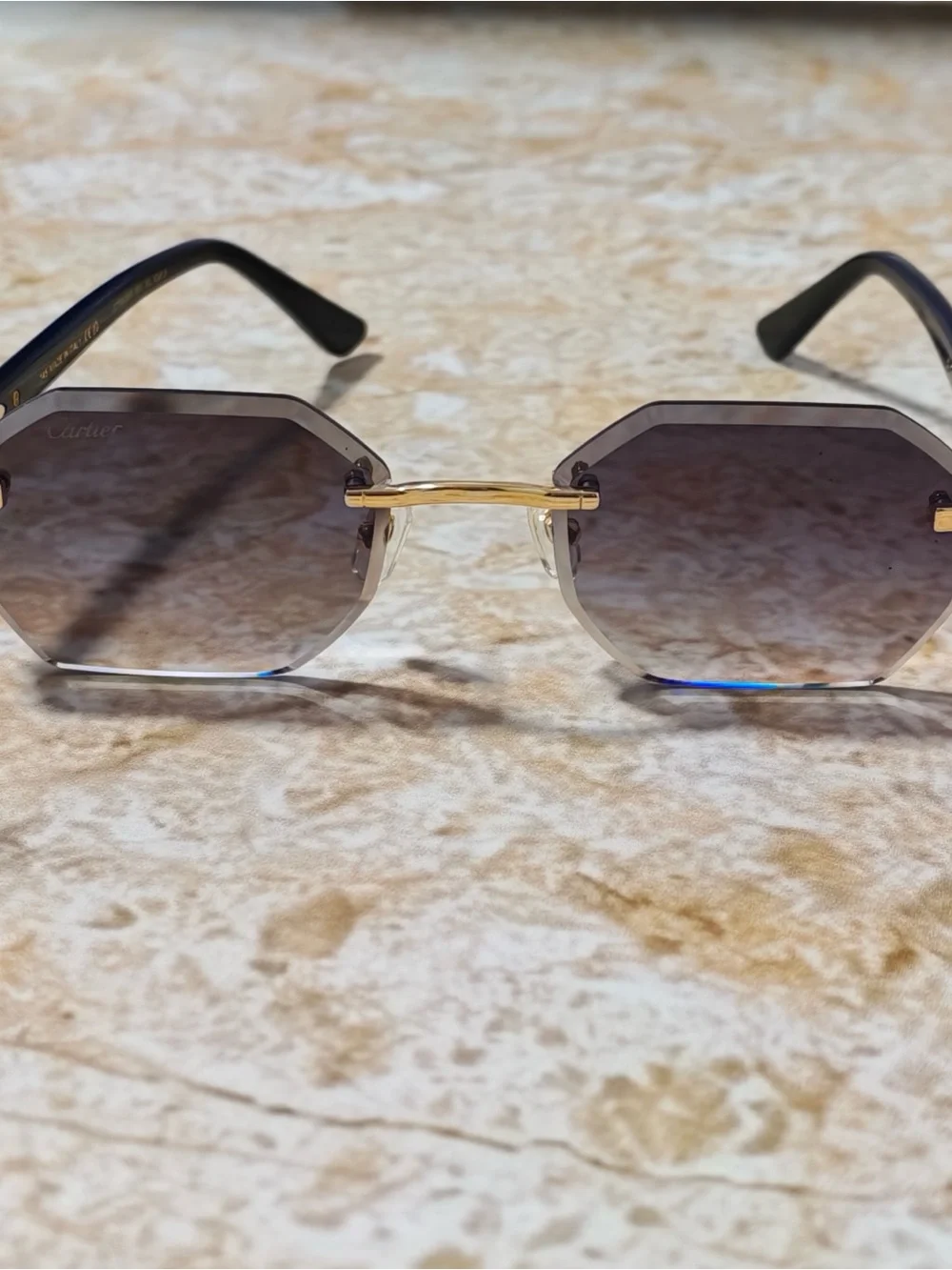 Cartier Women’s Rimless Sunglasses with Purple Gradient Lenses and Gold Accents